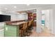 Finished basement with a modern bar area, comfortable seating, and a large screen TV for entertainment at 3607 Anna Nw Ln, Kennesaw, GA 30144