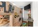 bedroom features a unique loft bed, mounted TV, and playful decor for a fun and imaginative space at 3607 Anna Nw Ln, Kennesaw, GA 30144