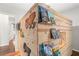 bedroom displaying an original playhouse bed design with books and play area at 3607 Anna Nw Ln, Kennesaw, GA 30144