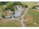 Aerial view of a fenced dog park featuring separate areas for large and small dogs with walking paths and landscaping at 3607 Anna Nw Ln, Kennesaw, GA 30144