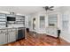 Bright kitchen offers gray cabinets, granite counters, stainless appliances, hardwood floors and backyard access at 3607 Anna Nw Ln, Kennesaw, GA 30144