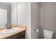 A bathroom with a classic vanity, mirror, and toilet at 4103 Mars Bay # 25, Acworth, GA 30101