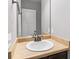 A bathroom with a classic vanity, mirror, and fixtures at 4103 Mars Bay # 25, Acworth, GA 30101
