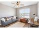 Bedroom offers a cozy space with a sofa, desk, and natural light from the large window at 4103 Mars Bay # 25, Acworth, GA 30101