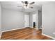 A bright bedroom featuring hardwood floors and a modern ceiling fan at 4103 Mars Bay # 25, Acworth, GA 30101