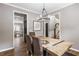 Dining area showcases a rustic wood table and views to the kitchen and stairwell at 4103 Mars Bay # 25, Acworth, GA 30101