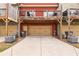 A view of the garages and back decks of townhomes with ample driveway space at 4103 Mars Bay # 25, Acworth, GA 30101