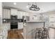 Open kitchen with white cabinetry, stainless steel appliances, and breakfast bar at 4103 Mars Bay # 25, Acworth, GA 30101