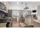 Open-concept kitchen with stainless steel appliances and a view of the dining area at 4103 Mars Bay # 25, Acworth, GA 30101