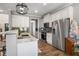 Bright kitchen with white cabinets, stainless appliances, and modern lighting at 4103 Mars Bay # 25, Acworth, GA 30101