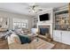 Inviting living room with a cozy fireplace and built-in shelves showcasing decor at 4103 Mars Bay # 25, Acworth, GA 30101