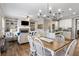 Open floor plan with a view of the living room with fireplace, kitchen, and dining area at 4103 Mars Bay # 25, Acworth, GA 30101