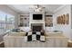Comfortable living room with fireplace, built-in shelves, and natural light at 4103 Mars Bay # 25, Acworth, GA 30101