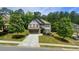 Beautiful aerial view of the home and neighborhood with mature trees at 109 Red Fox Dr, Dallas, GA 30157