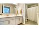 Bright bathroom featuring a dual sink vanity with white countertop and shower at 109 Red Fox Dr, Dallas, GA 30157