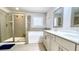 Bathroom featuring a tiled shower, soaking tub, and double vanity at 109 Red Fox Dr, Dallas, GA 30157