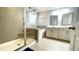 Bathroom featuring a tiled shower, soaking tub, and double vanity at 109 Red Fox Dr, Dallas, GA 30157