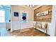 Inviting foyer with wood accent wall, bench seating, decorative sign, and a glass-paneled front door at 109 Red Fox Dr, Dallas, GA 30157