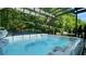 Inviting hot tub nestled within a wooden pergola, surrounded by lush greenery and outdoor seating at 109 Red Fox Dr, Dallas, GA 30157