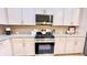 Well-equipped kitchen with stainless steel gas range, granite countertops, and ample cabinet space at 109 Red Fox Dr, Dallas, GA 30157