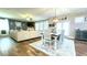 Open concept living and dining area with wood floors and a neutral color palette at 109 Red Fox Dr, Dallas, GA 30157