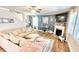 Stylish living room featuring a fireplace, large sectional, and wood-look floors at 109 Red Fox Dr, Dallas, GA 30157