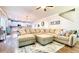Open floorplan living room showcasing a large sectional and decorative rug at 109 Red Fox Dr, Dallas, GA 30157