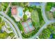 Aerial showcasing community pool and tennis courts close to neighborhood homes, creating an ideal blend of recreation and community at 1336 Amberwood Dr, Woodstock, GA 30189