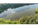 Lush forest leading to a tranquil lake, offering a serene escape and picturesque views at 1336 Amberwood Dr, Woodstock, GA 30189