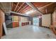 Unfinished basement featuring exposed wooden beams, concrete floor, and potential for customization at 1336 Amberwood Dr, Woodstock, GA 30189