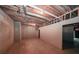 Spacious unfinished basement with exposed beams, concrete walls, and ample potential for custom design at 1336 Amberwood Dr, Woodstock, GA 30189