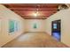 Unfinished basement featuring concrete floor, exposed ceiling, and natural light from the exterior windows at 1336 Amberwood Dr, Woodstock, GA 30189