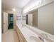 Bright bathroom boasts double sinks, large mirror, and ample counter space at 1336 Amberwood Dr, Woodstock, GA 30189