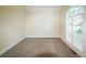 Bright, carpeted bedroom with arched window and shuttered doors leading to the exterior at 1336 Amberwood Dr, Woodstock, GA 30189