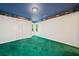 This bedroom features unique wallpaper and paint, with green carpet and two windows at 1336 Amberwood Dr, Woodstock, GA 30189