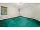 Spacious bedroom featuring neutral walls and green carpet, illuminated by natural light at 1336 Amberwood Dr, Woodstock, GA 30189