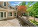 A spacious wooden deck offers an idyllic outdoor retreat, blending seamlessly with the surrounding mature trees at 1336 Amberwood Dr, Woodstock, GA 30189