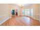 Elegant dining room with hardwood floors, chandelier, and bright windows with shuttered doors at 1336 Amberwood Dr, Woodstock, GA 30189