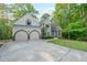 Inviting home with well-maintained lawn, spacious driveway, and a classic facade at 1336 Amberwood Dr, Woodstock, GA 30189