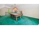 Upstairs game room with pool table and green carpet for entertainment at 1336 Amberwood Dr, Woodstock, GA 30189