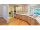 Spacious kitchen featuring light wood cabinetry, stainless steel appliances, and hardwood floors at 1336 Amberwood Dr, Woodstock, GA 30189