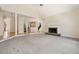 Open living area with fireplace, hardwood floors, and access to kitchen and dining at 1336 Amberwood Dr, Woodstock, GA 30189