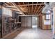 Unfinished basement with bare ceiling and some wall damage, has potential at 2311 Cherry Blossom Sw Dr, Atlanta, GA 30331