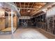 View of the unfinished basement featuring a staircase and exposed ductwork at 2311 Cherry Blossom Sw Dr, Atlanta, GA 30331