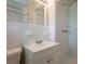 Modest bathroom features a single sink vanity, medicine cabinet and tile surround shower at 2311 Cherry Blossom Sw Dr, Atlanta, GA 30331