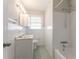Bathroom with vanity, tiled shower, and updated light fixtures at 2311 Cherry Blossom Sw Dr, Atlanta, GA 30331