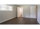 This bedroom opens to the bathroom and has modern wood-look floors at 2311 Cherry Blossom Sw Dr, Atlanta, GA 30331