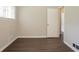The bedroom features wood-look floors and a view into an adjoining space at 2311 Cherry Blossom Sw Dr, Atlanta, GA 30331