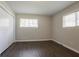 This bedroom features modern flooring, ample closet space and a large window at 2311 Cherry Blossom Sw Dr, Atlanta, GA 30331