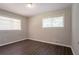 Bedroom featuring hardwood floors, a large window, and neutral paint at 2311 Cherry Blossom Sw Dr, Atlanta, GA 30331